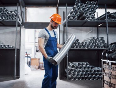 portrait-young-worker-hard-hat-large-metalworking-plant